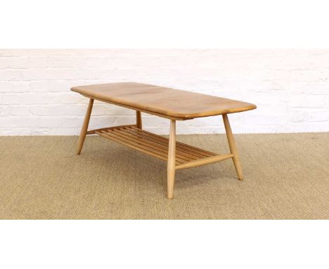 Lucian Ercolani for Ercol "Model 7459" Coffee Table The shaped oval blonde elm top on turned ash supports and spindle underti