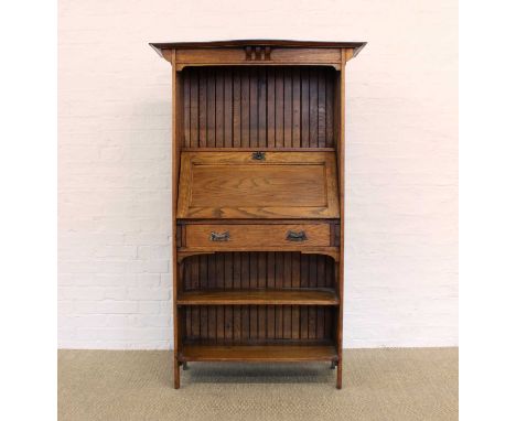 Arts & Crafts Oak Bureau Circa 1890-1910, with serpentine cornice above fall-front with fitted interior and single drawer fla