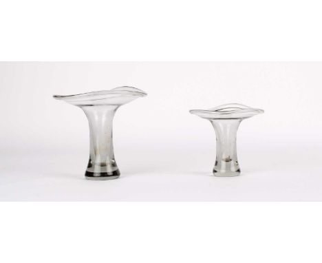 Vicke Lindstrand (Swedish 1904-1983) for Kosta Two Graduated "Chanterelle" Vases  Circa 1950s, clear to smoked glass, the lar