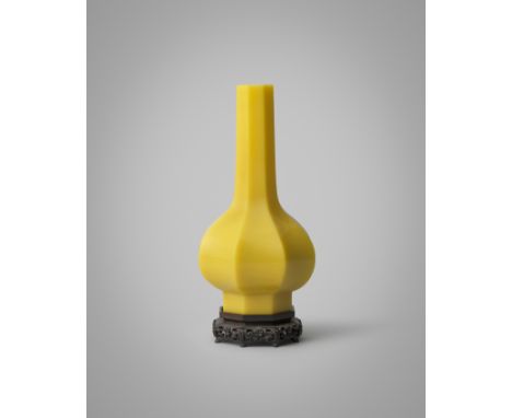 A CHINESE IMPERIAL FACETED YELLOW BEIJING GLASS BOTTLE VASE FOUR CHARACTER QIANLONG MARK AND OF THE PERIOD 1736-95 With a bul