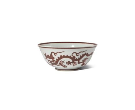 A RARE CHINESE UNDERGLAZE RED 'DRAGON' BOWL 1ST HALF 16TH CENTURY The gently flared body decorated with two scaly dragons cha