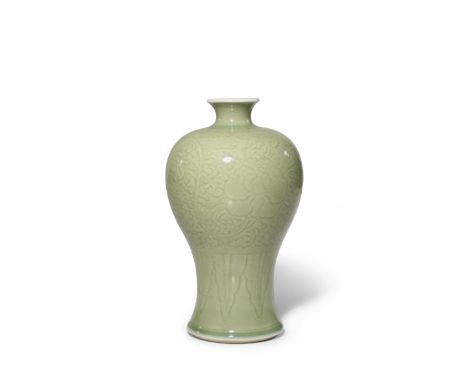 A CHINESE CELADON MEIPING KANGXI 1662-1722 With a short waisted neck and a gently flaring foot, the body carved with three sc