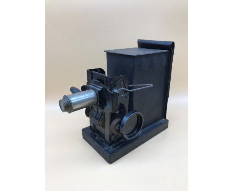Vintage magic lantern. Measures 19cm in height. 