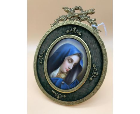 An Antique miniature lady portrait on ceramic. Fitted in a gilt brass and green material frame possibly Regency era. Measures