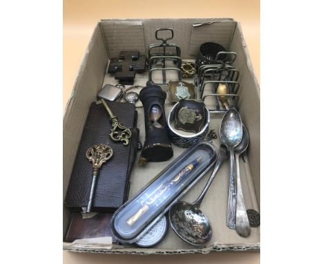 A box of mixed collectables which includes Victorian cross door knocker, military buckles and various EP items. 