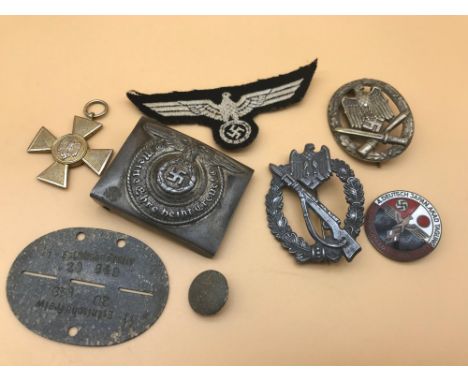 A Lot of various WW2 German Nazi cap badges, buckle, medal and enamel badge. 