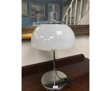 Genuine Harvey Guzzini table lamp, Rise and fall movement. Styled with a mushroom shade. Has original sticker to the shade. W