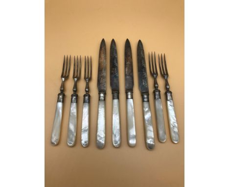 A Lot of fork and knives, styled with mother of pearl handles and Sheffield silver collars. 