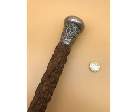 A Chinese silver topped walking stick. Measures 91.5cm in length. 