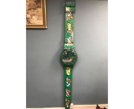 A Large Swatch watch shop adverting clock. Measures 200cm in length. Working. 