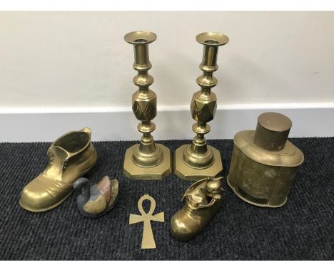 A lot of brass wares which includes the Queen of diamond push candle sticks, Brass boot and brass tea caddy. 