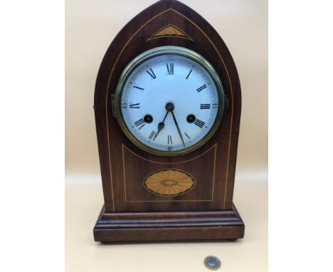 An Edwardian mantle clock, Enamel 2 hole face. Measures 34.5cm in height. Running condition. 