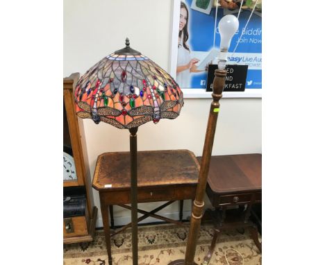 A Tiffany style floor standing lamp, Fitted with a dragon fly design shade (Repaired) together with an oak standard lamp. bot