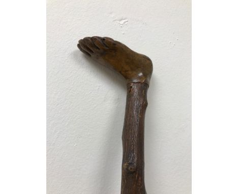 A Victorian hand carved foot handle walking stick. 