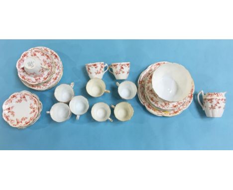 A Charles Wileman 'Foley China' part tea set comprising; six side plates, five saucers and four cups and a Shelley tea set co