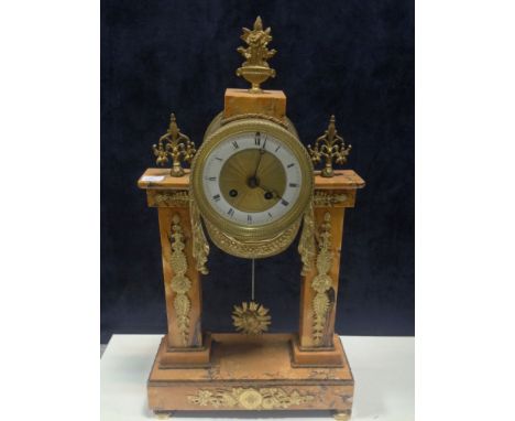 A French Sienna marble and gilt metal mounted portico clock, the enamelled chapter ring with Roman numerals and Mougin drum b