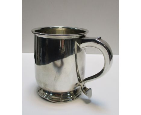 A silver pint beer mug, by The Adie Brothers, Birmingham 1932, of cylindrical form with low pedestal foot, 'S' scroll handle,