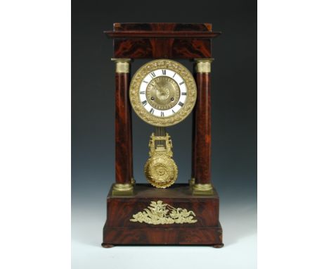 An Empire mahogany portico clock, the typical case with four supporting columns, white chapter ring with gilt metal centre, b