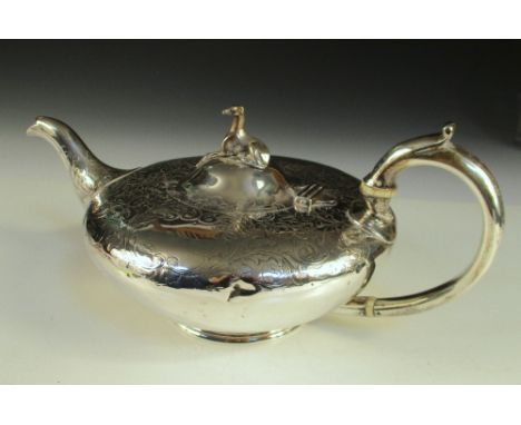 A Victorian silver teapot, by William Richards, London 1842, of compressed circular form with engraved floral pattern on a mo