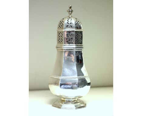 An Edwardian silver sugar caster, by Nathan and Hayes, Chester 1909, the plain octagonal body with moulded edges and girdle b