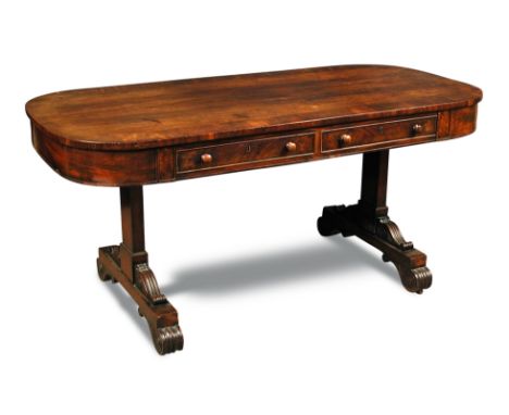 A late Regency mahogany library table, with rounded ends and crossbanded border decoration, fitted drawers on both sides and 