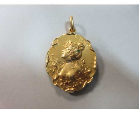 A French art nouveau 18ct gold and gemset locket with mirror, of oval outline, swivelling to open, and cast in bas relief wit