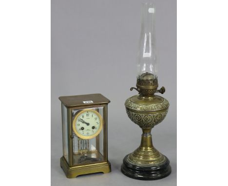A French brass-cased mantel clock the 3½” diameter white enamel dial signed “Nokes, Bath”, &amp; with a chiming movement, 9¾”
