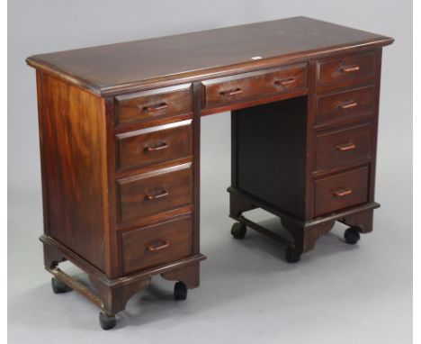 A vintage Bath Cabinet Makers mahogany kneehole desk made by Edgar George Milsom,&nbsp;fitted with an arrangement of nine dra