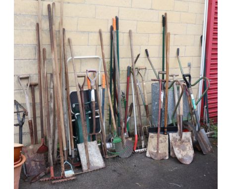 A Black &amp; Decker leaf blower; a wheelbarrow; &amp; various garden tools &amp; hand tools. 