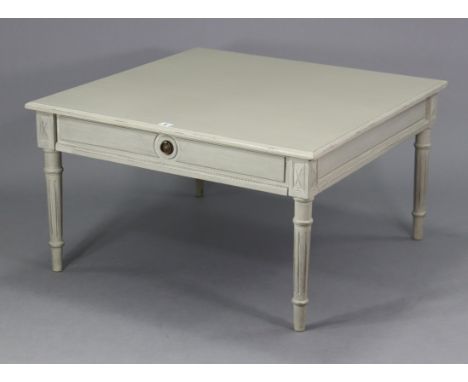 A light grey painted wooden low coffee table with a square top, fitted frieze drawer, &amp; on four fluted &amp; turned legs,