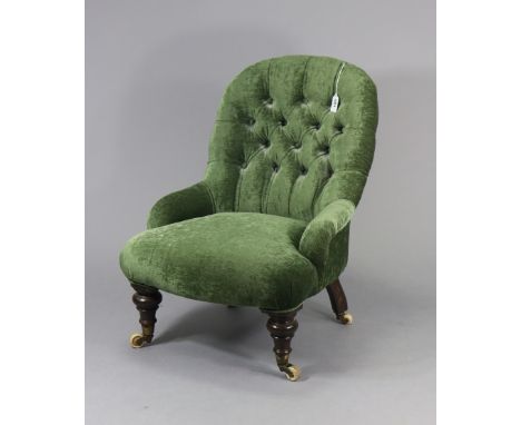 A Victorian buttoned-back child’s chair with a sprung seat upholstered green velour, &amp; on short turned legs with ceramic 