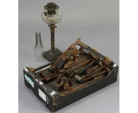 A brass oil table lamp with a clear-glass reservoir; together with an anglepoise-type desk lamp; various vintage carpenter’s 