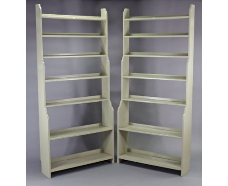 A pair of light grey painted wooden tall standing seven-tier “waterfall” bookcases, 35¼” wide x 78¼” high. 