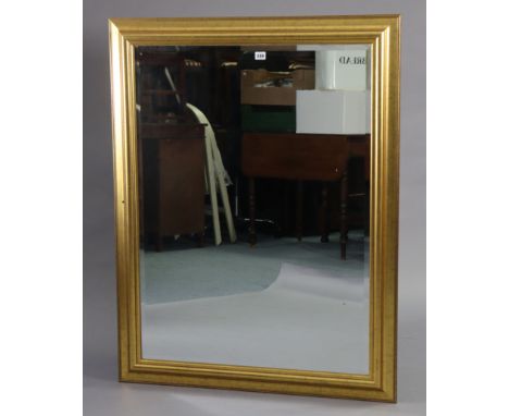 A large rectangular wall mirror inset bevelled plate, &amp; in a gilt frame, 46” x 35¾”. 
