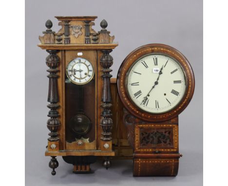 A late 19th century drop-dial wall clock with black Roman numerals to the 11½” diameter white enamel dial, with striking move