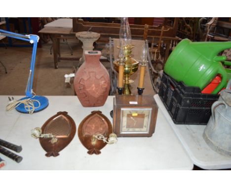 A brass oil lamp; a pair of ornate candle style lamps; a pair of shaped mirrors; Art Deco clock etc. 