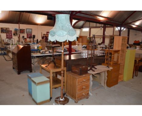 A turned wooden standard lamp and tasselled shade 