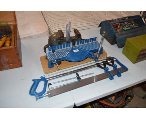 A bench vice and mitre saw 