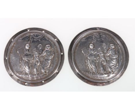 Pair of Charles II Christ's Hospital silver cloak badges, after J Routiers, embossed with a blue coat boy and figures of Arit