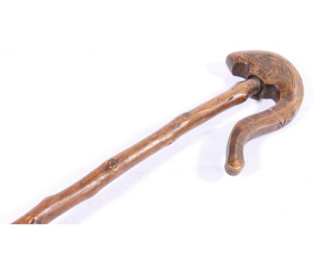 19th century chip carved walking stick, the swan neck handle carved with serpent and bird, possibly Scandinavian, 99cm.