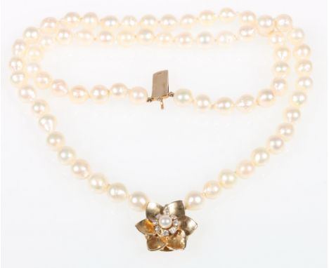 Natural pearl double strand necklet with paste and pearl set flowerhead clasp, stamped 14k CONDITION REPORT: Natural pearls.