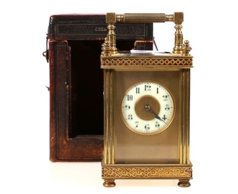 Victorian French brass carriage clock, retailed by Howell James & Co., with pillar case and enamel Arabic dial, striking on a