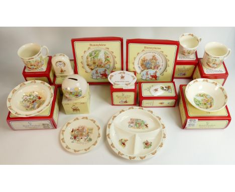 A collection of Royal Doulton Bunnykins nursery ware to include tea cup, one handled hug a mug, saucer, divider dish, baby di