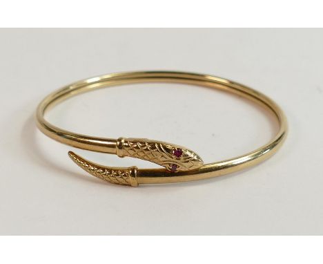 9ct hallmarked gold snake bangle set red stone eyes, weight 10.7g, including fine steel spring to core. 