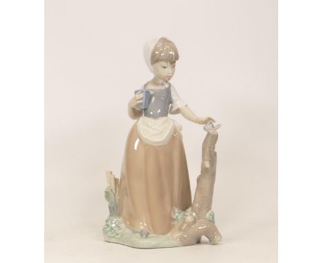 Nao figurine of a girl with butterfly. Height 22cm 