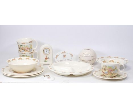 A collection of Royal Doulton Bunnykins nursery ware to include tea cup, one handled hug a mug, saucer, divider dish, baby di