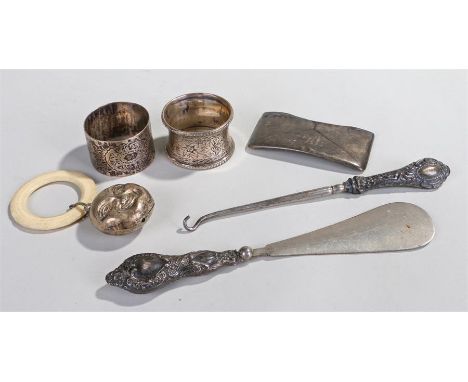 A collection of silver objects to include a silver handled button hook, Birmingham 1906, maker J.G , a silver handled shoe ho