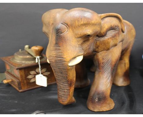 carved wooden elephant, together with a hand painted coffee grinder