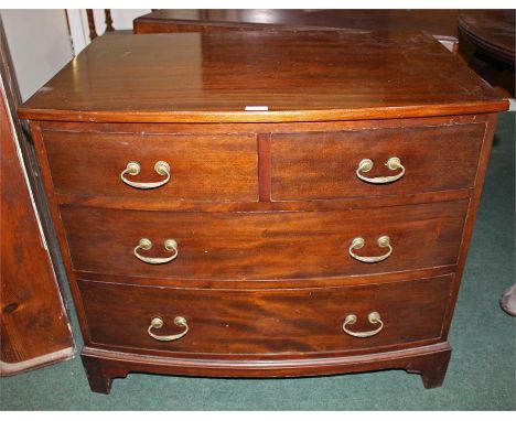 Mahogany bow front chest of drawers, of small proportions, the bow front top above two short and two long drawers raised on b