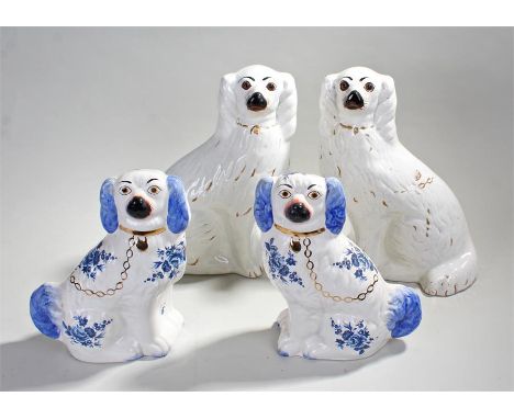 Pair of mantelpiece dogs, 34cm in height, together with a second pair (4)